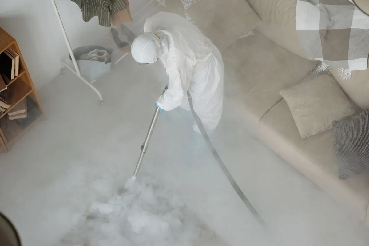 Biohazard cleanup technician in protective equipment, Key West, FL